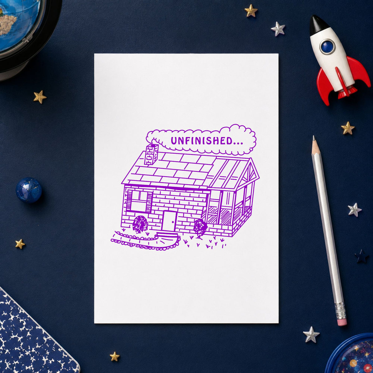 Unfinished Work Reminder Rubber Stamp impression in purple ink on white paper in a styled craft setting.