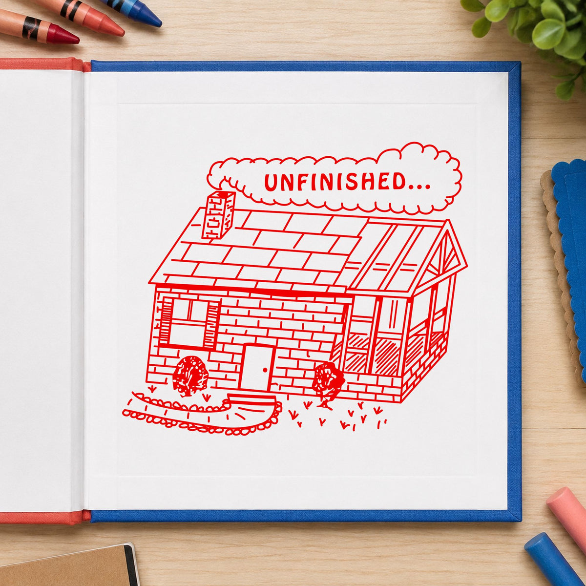 Unfinished Work Reminder Rubber Stamp impression in red ink on white paper in a styled craft setting.