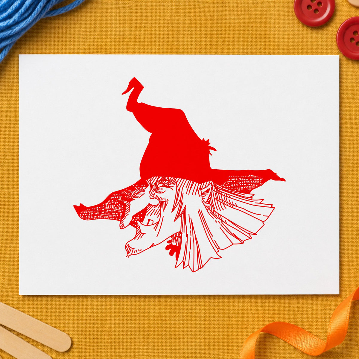 Witch Head with Hat Rubber Stamp impression in red ink on white paper in a styled craft setting.