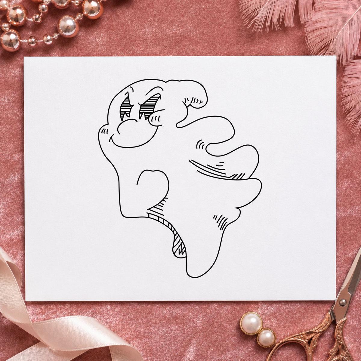 Black impression from a ghost rubber stamp, featuring the friendly smiling ghost design on white paper.