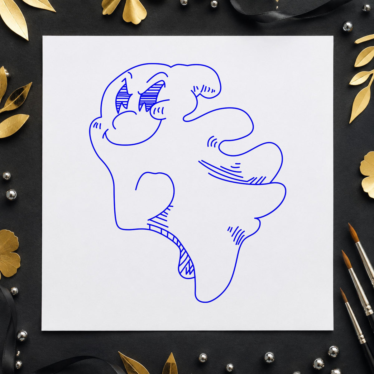 Blue halloween paper craft stamp impression featuring the friendly smiling ghost design on white paper.