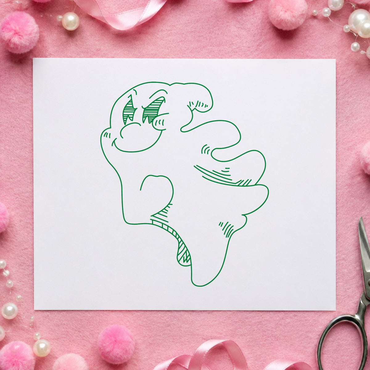 Friendly Smiling Ghost Rubber Stamp impression in green ink on white paper in a styled craft setting.