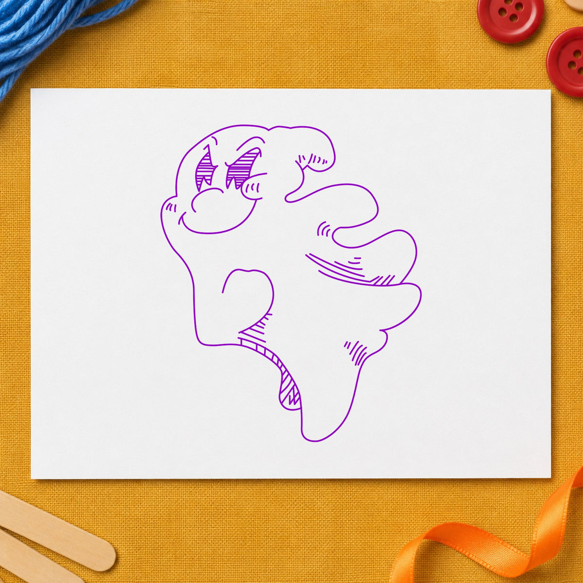 Friendly Smiling Ghost Rubber Stamp impression in purple ink on white paper in a styled craft setting.