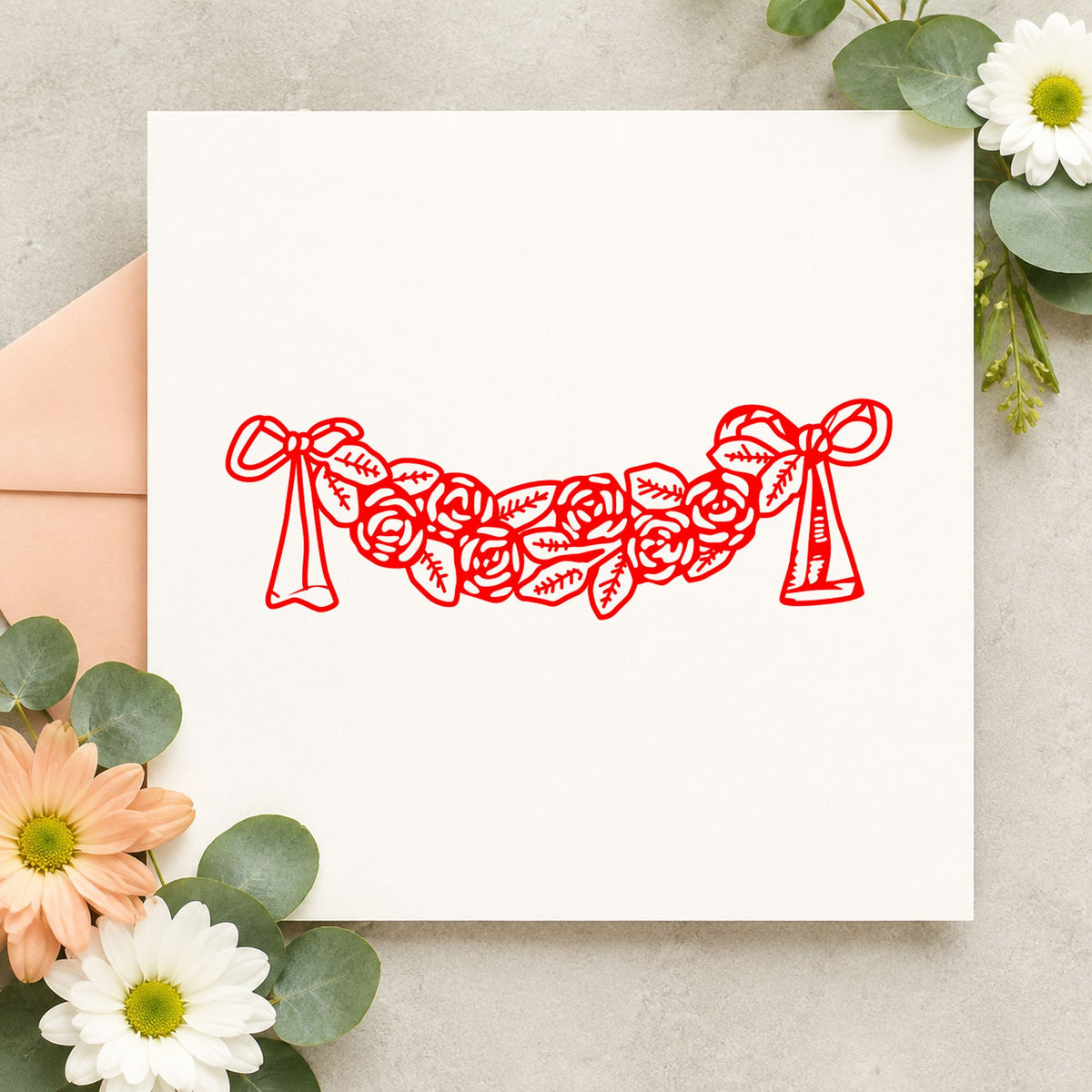 Rose Swag with Bows Rubber Stamp impression in red ink on white paper in a styled craft setting.