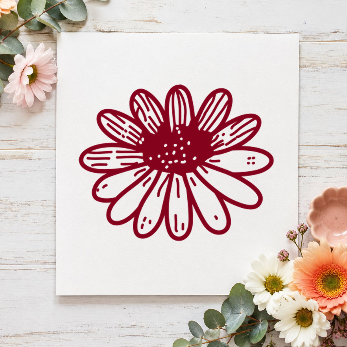 Daisy Flower Rubber Stamp Small impression in burgundy ink on white paper in a styled craft setting.