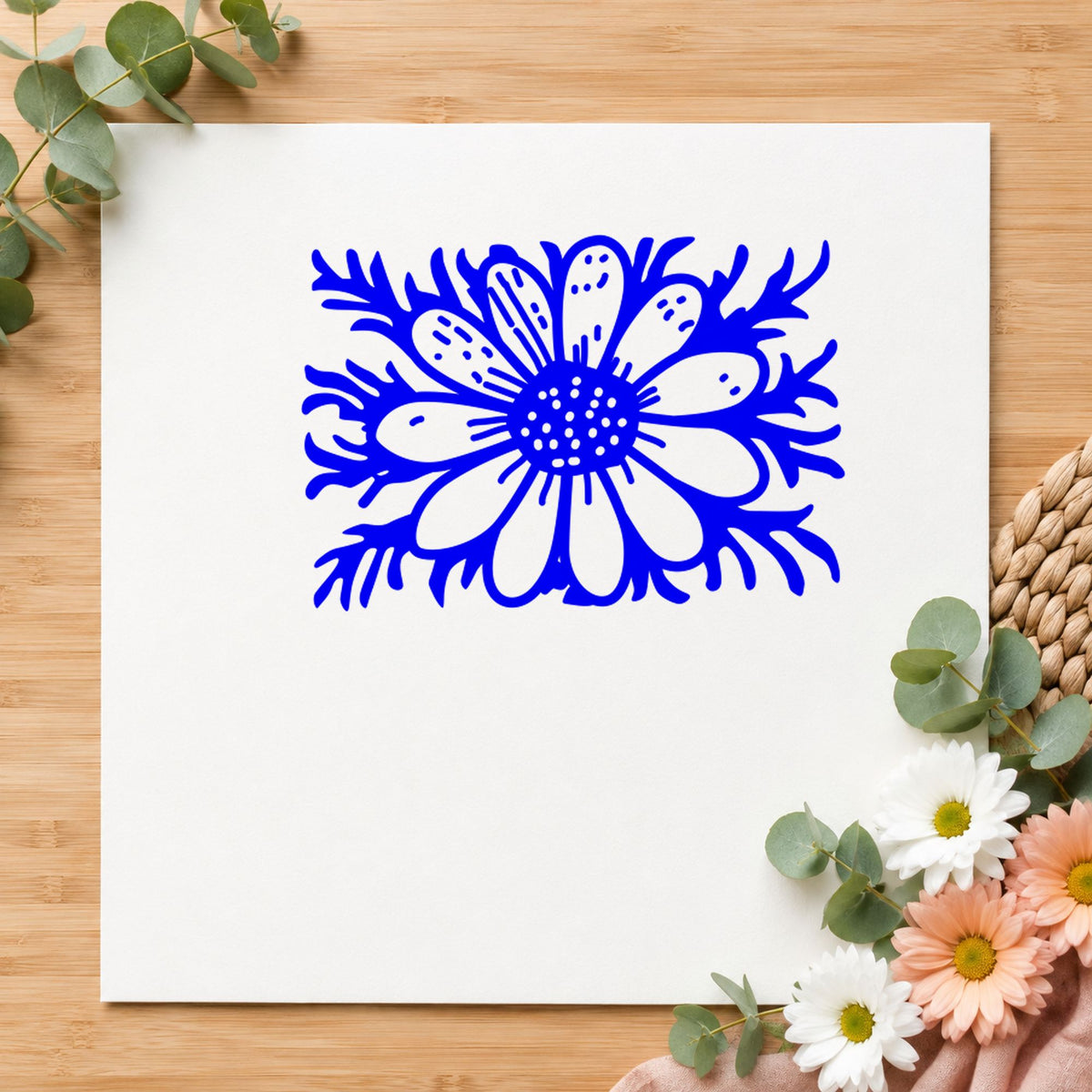 Daisy with Stem Rubber Stamp Small impression in blue ink on white paper in a styled craft setting.