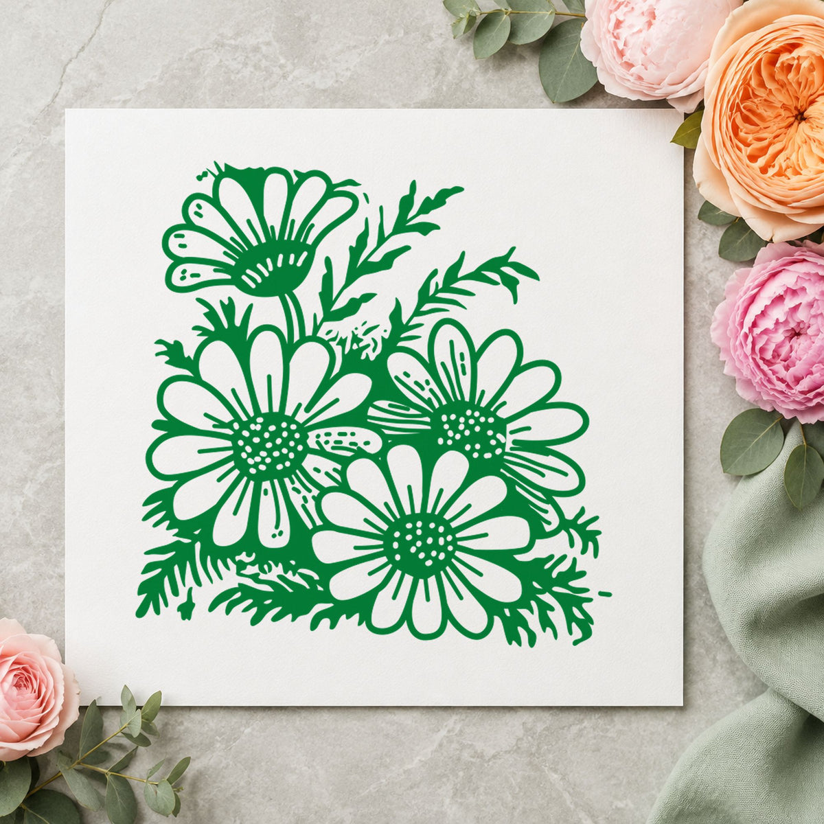 Four Daisy Blooms Rubber Stamp impression in green ink on white paper in a styled craft setting.
