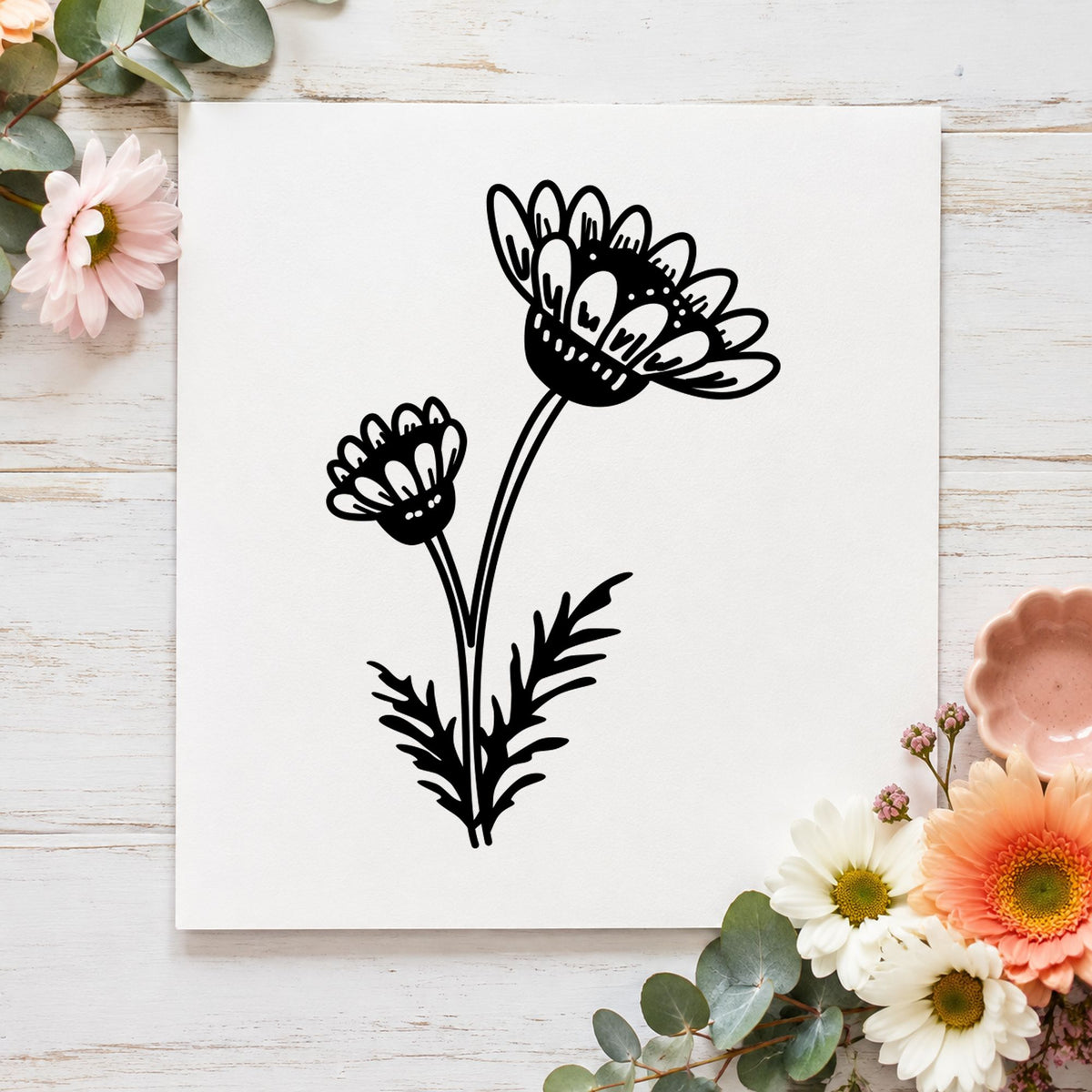 Two Daisies on a Stem Rubber Stamp impression in black ink on white paper in a styled craft setting.