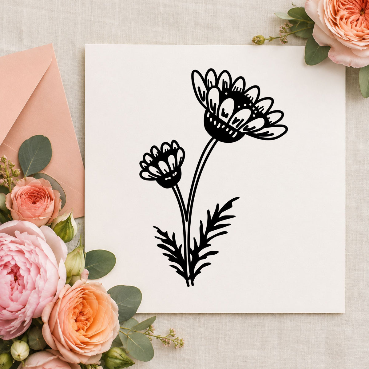 Black impression from a daisy flower stamp, featuring the two daisies on a stem design on white paper.