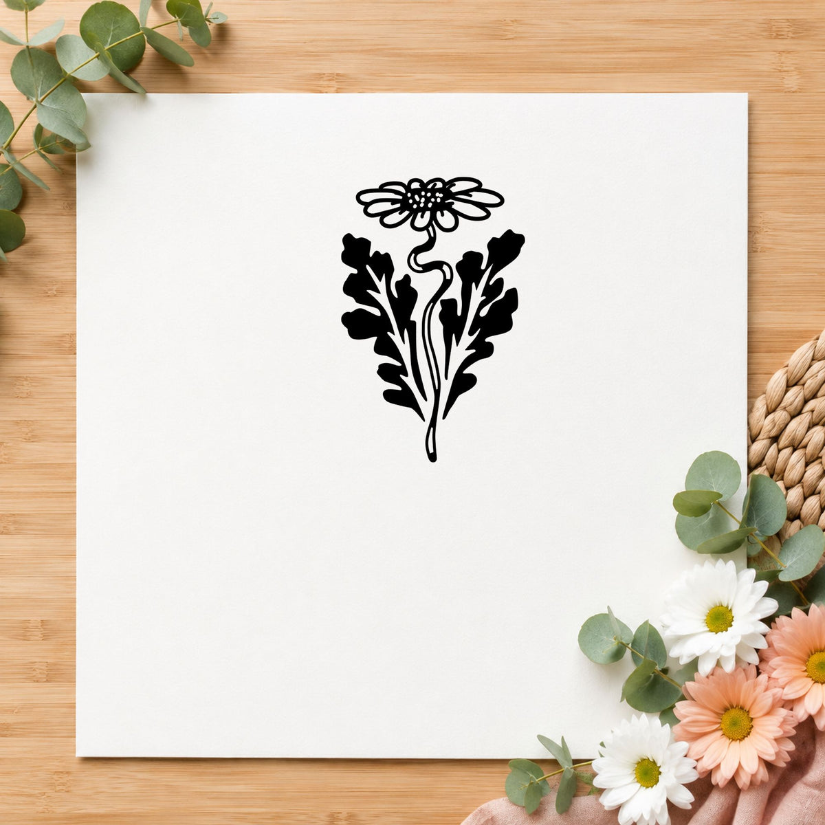 Daisy with Leaf Rubber Stamp impression in black ink on white paper in a styled craft setting.