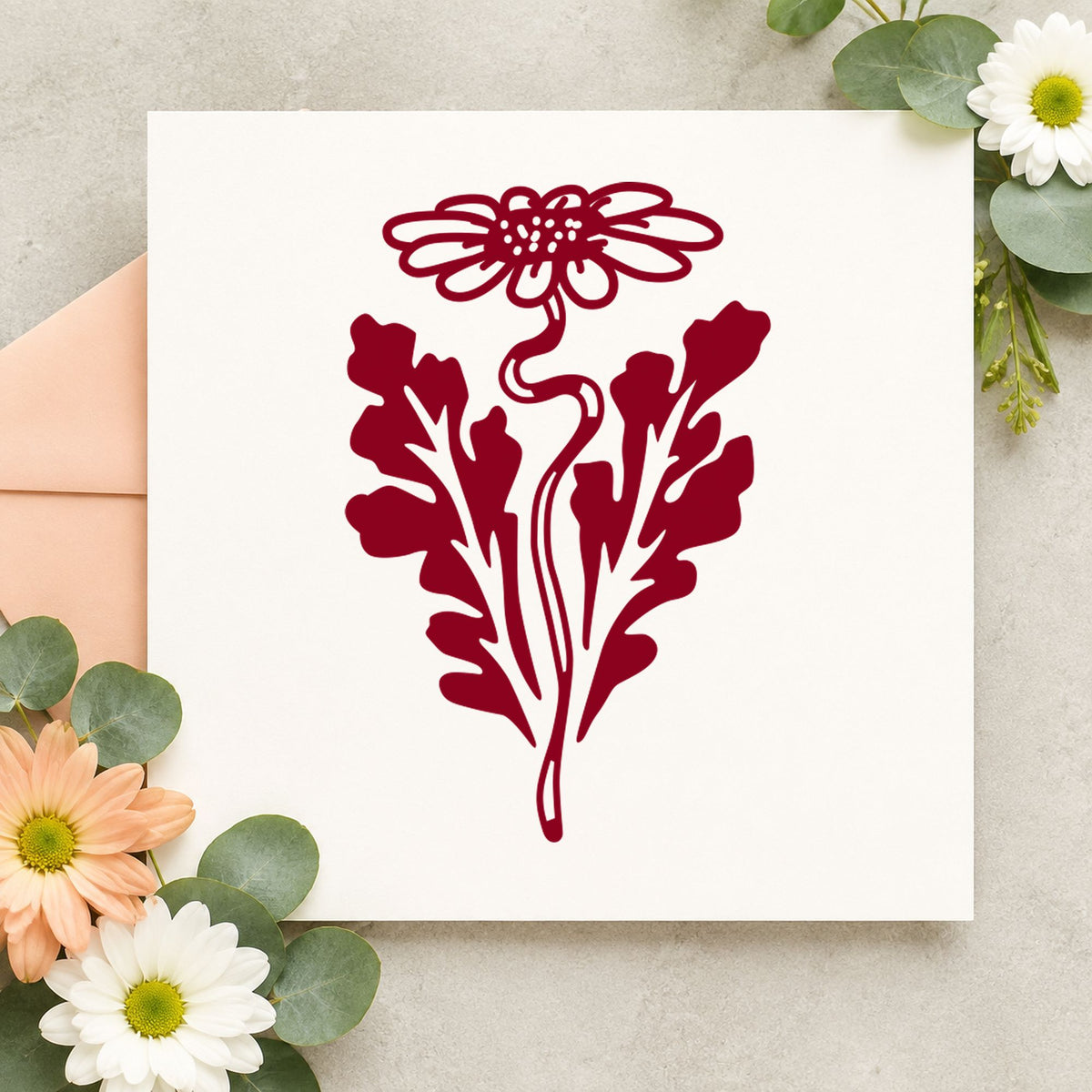 Daisy with Leaf Rubber Stamp impression in burgundy ink on white paper in a styled craft setting.