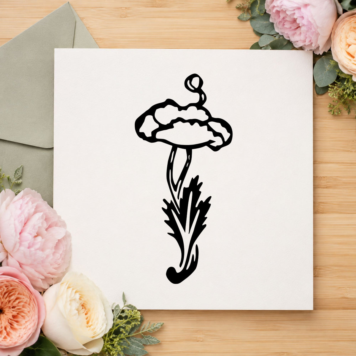 Single Flower with Stem Rubber Stamp impression in black ink on white paper in a styled craft setting.