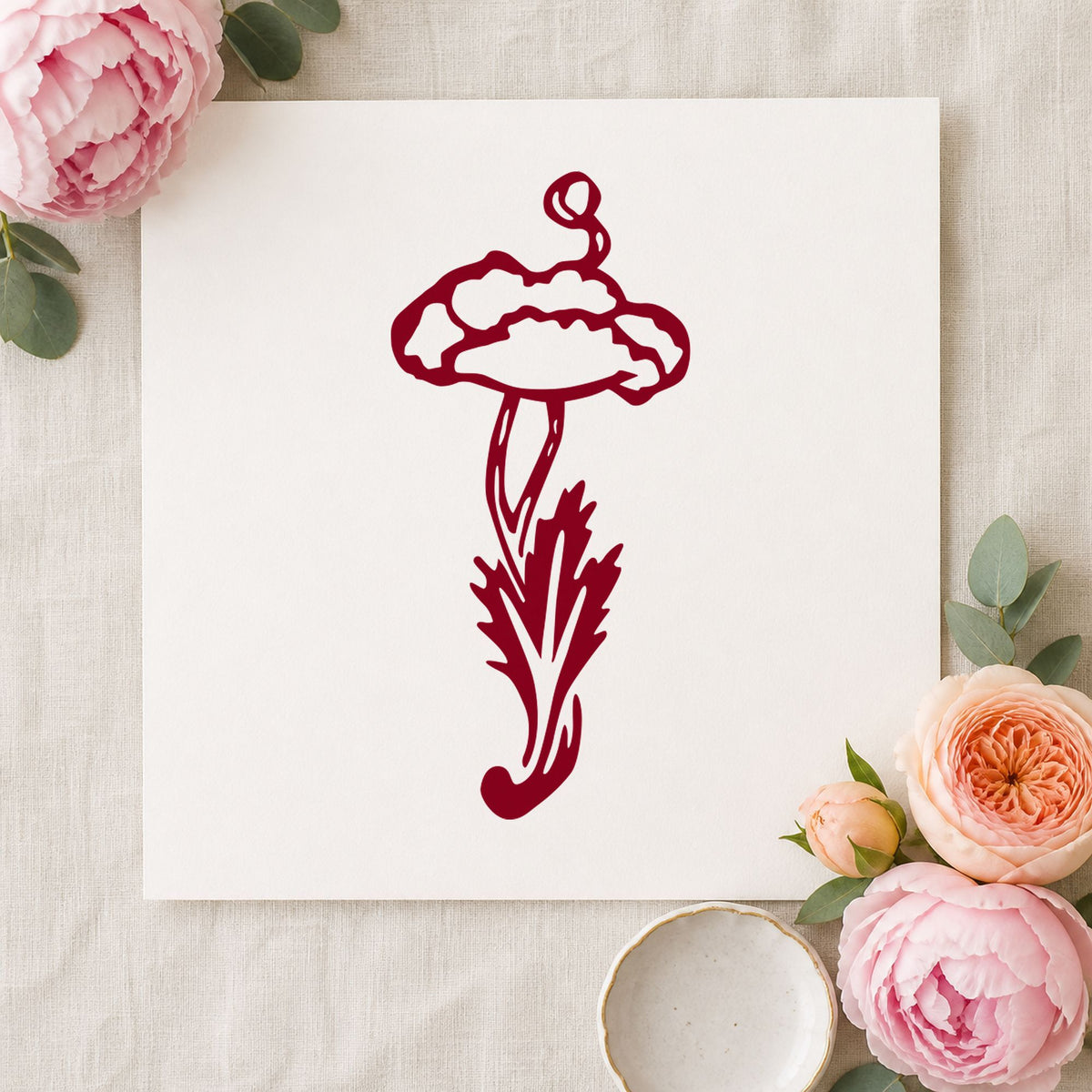 Single Flower with Stem Rubber Stamp impression in burgundy ink on white paper in a styled craft setting.