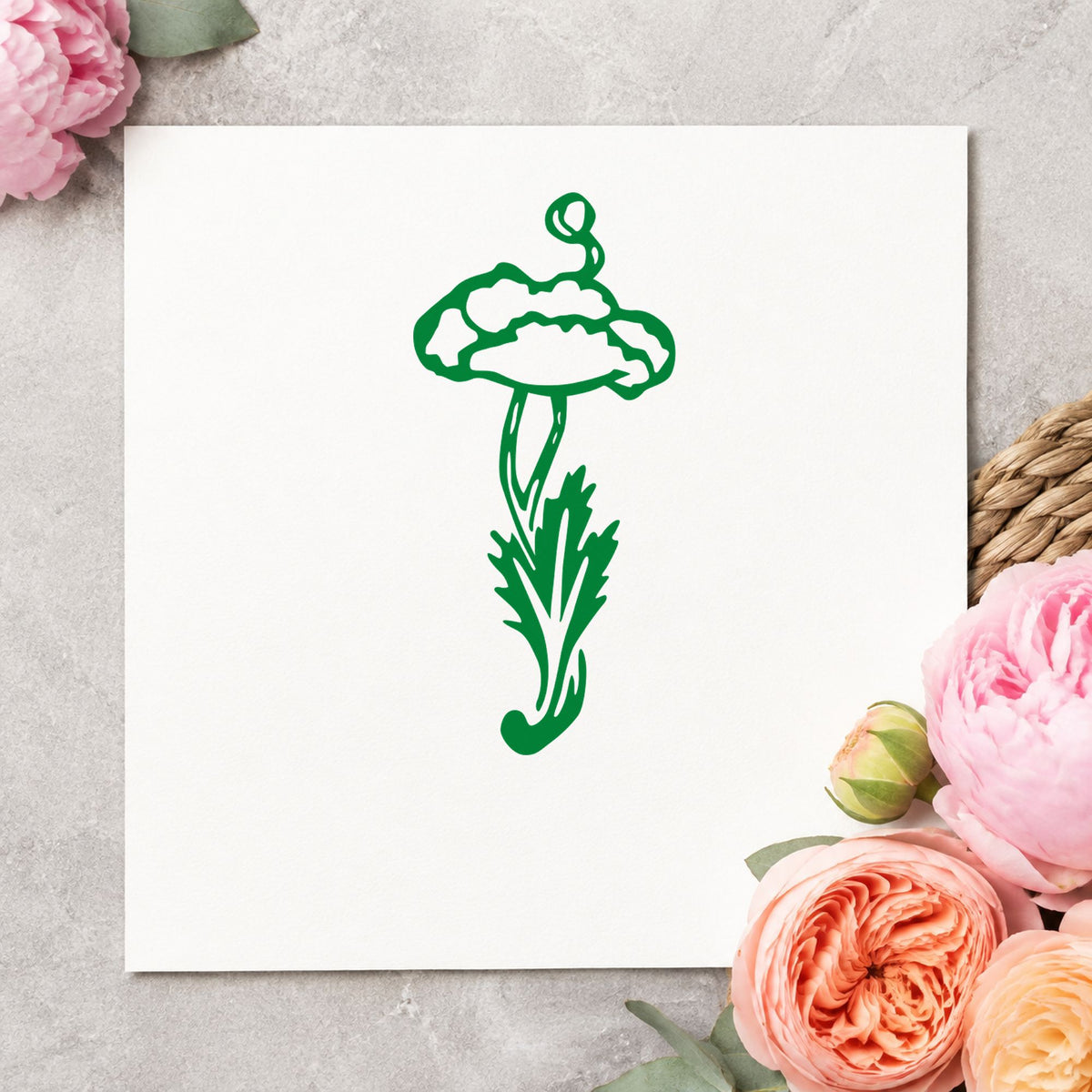 Single Flower with Stem Rubber Stamp impression in green ink on white paper in a styled craft setting.