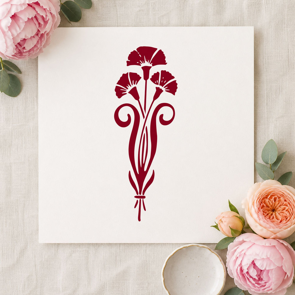 Three Flowers in a Vase Rubber Stamp impression in burgundy ink on white paper in a styled craft setting.