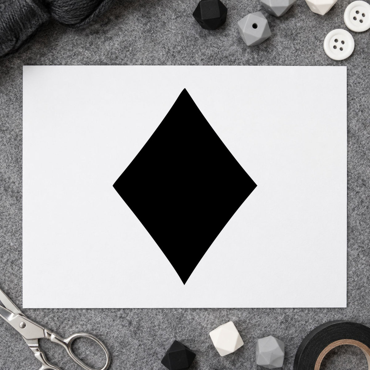 Playing Card Diamond Rubber Stamp impression in black ink on white paper in a styled craft setting.