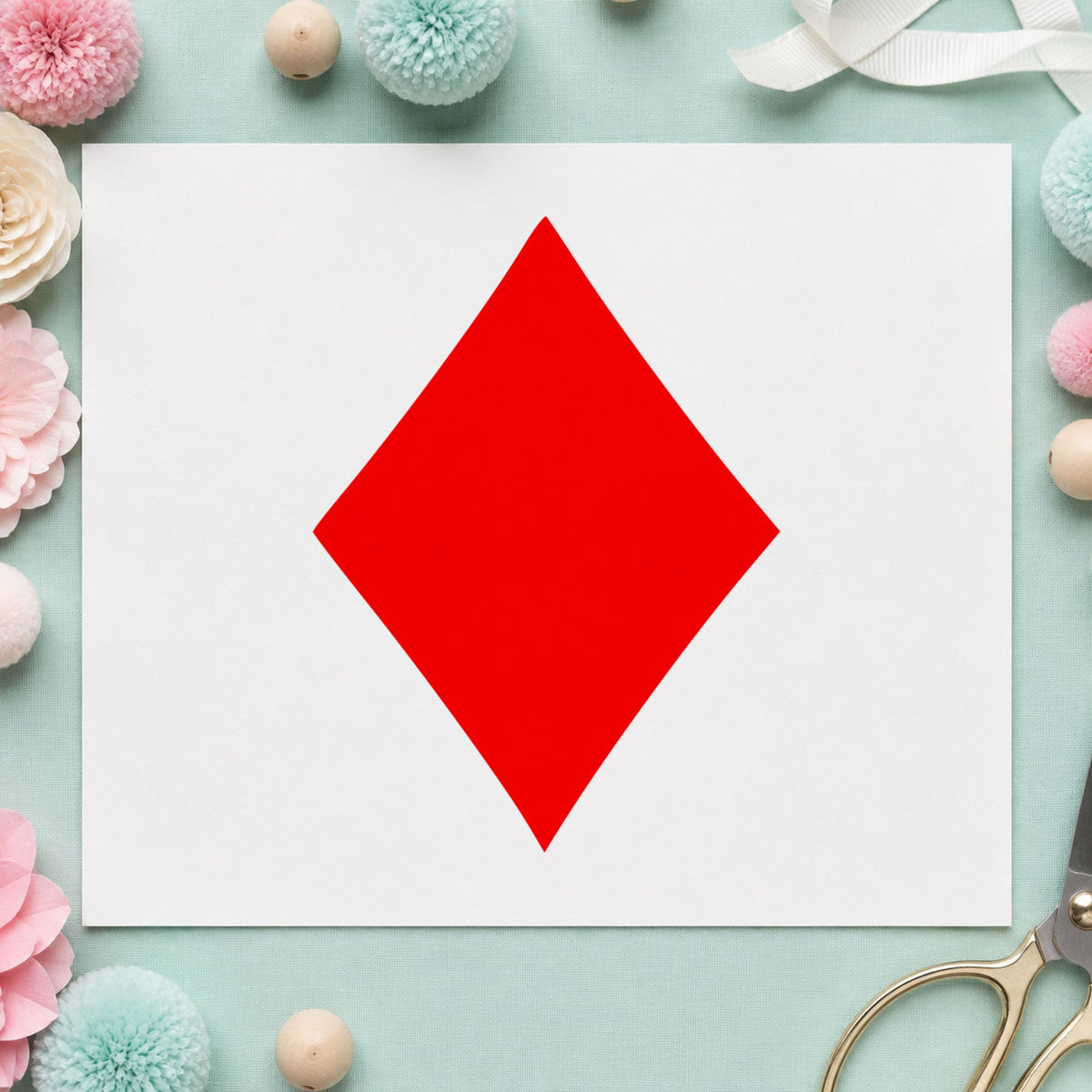 Playing Card Diamond Rubber Stamp impression in red ink on white paper in a styled craft setting.