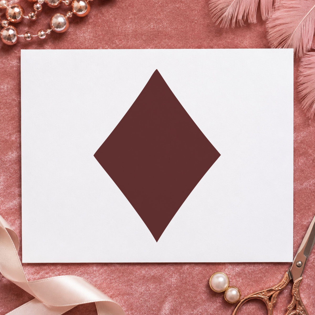 Playing Card Diamond Rubber Stamp impression in brown ink on white paper in a styled craft setting.