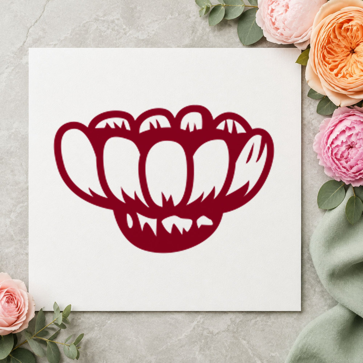 Sideways Daisy Rubber Stamp impression in burgundy ink on white paper in a styled craft setting.