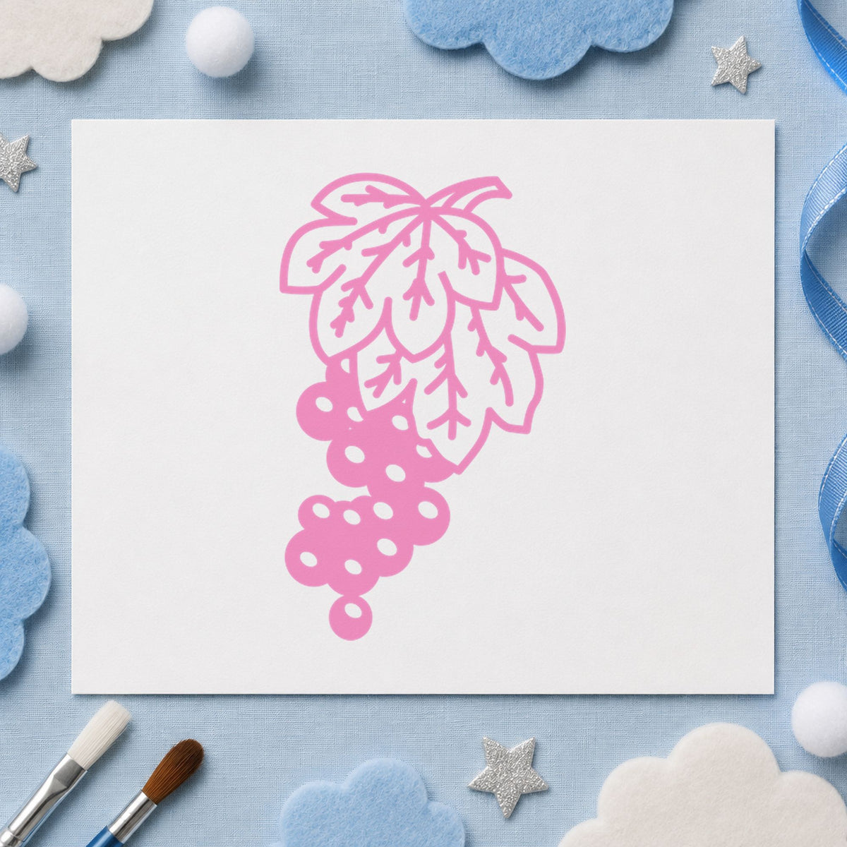 Grape Bunch on Vine Rubber Stamp impression in pink ink on white paper in a styled craft setting.