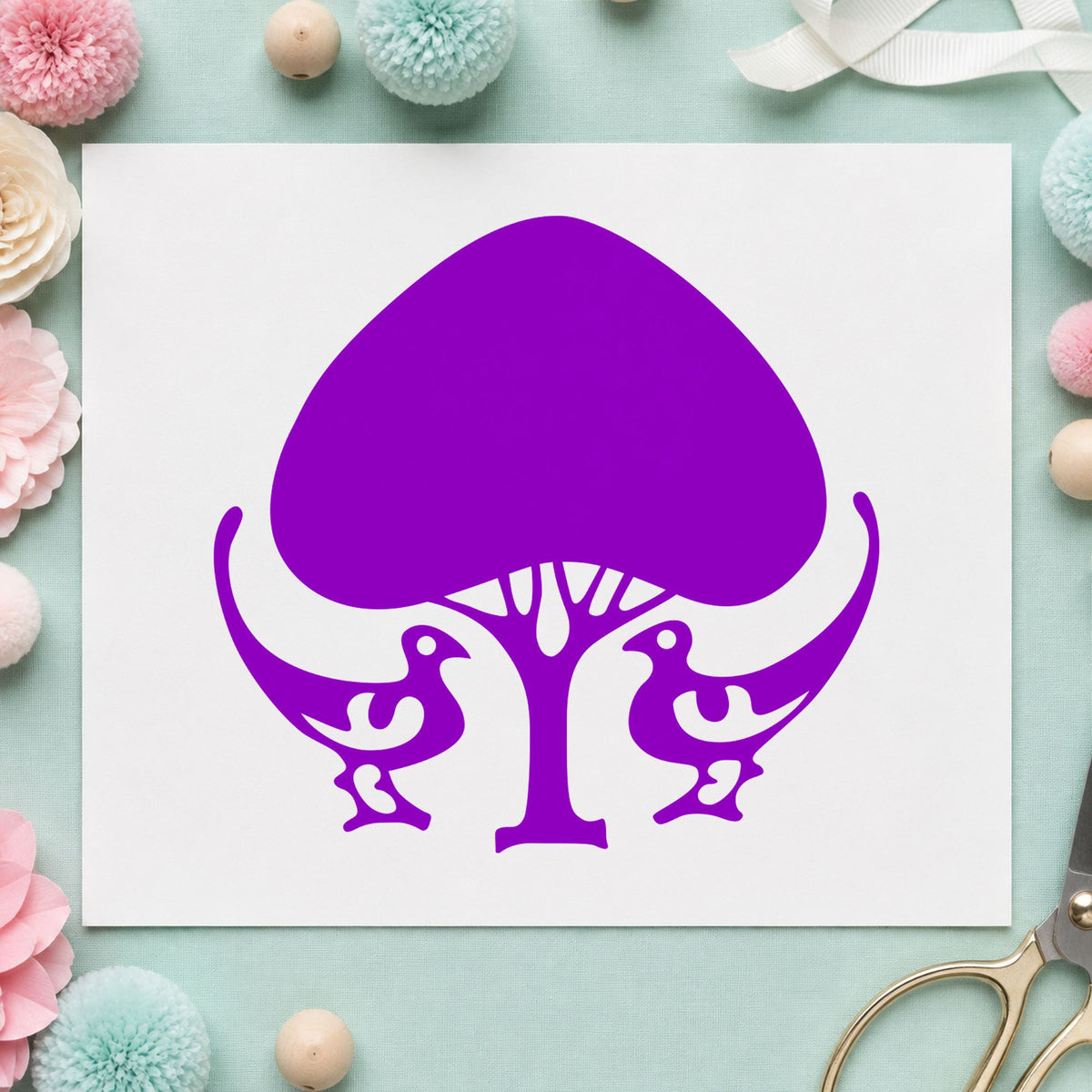 Leafy Tree and Birds Rubber Stamp impression in purple ink on white paper in a styled craft setting.