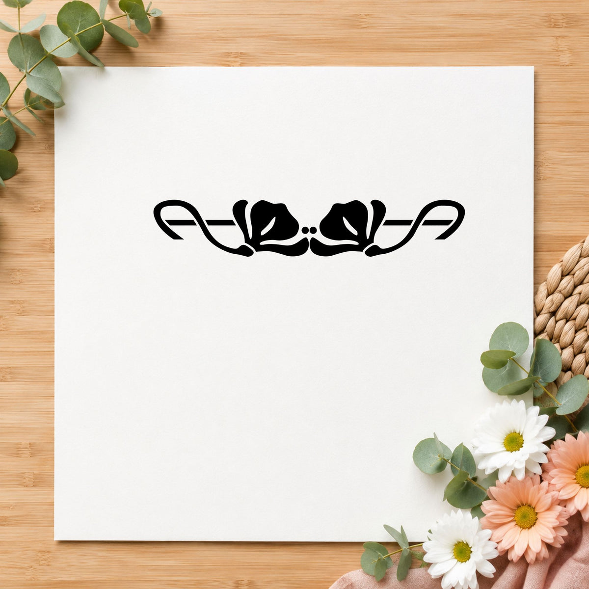 Black impression from a flower border stamp, featuring the double flower border design on white paper.