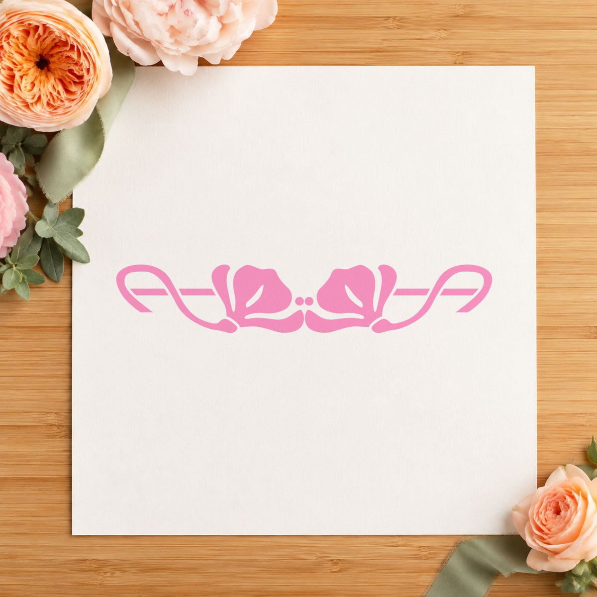 Double Flower Border Rubber Stamp impression in pink ink on white paper in a styled craft setting.
