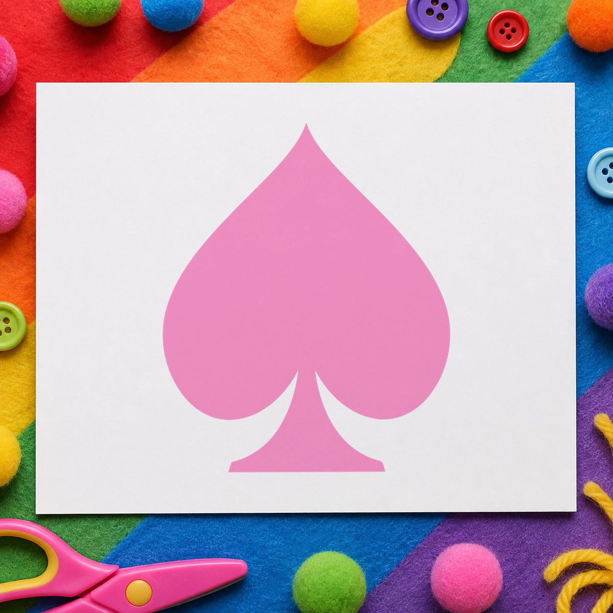 Playing Card Spade Rubber Stamp impression in pink ink on white paper in a styled craft setting.