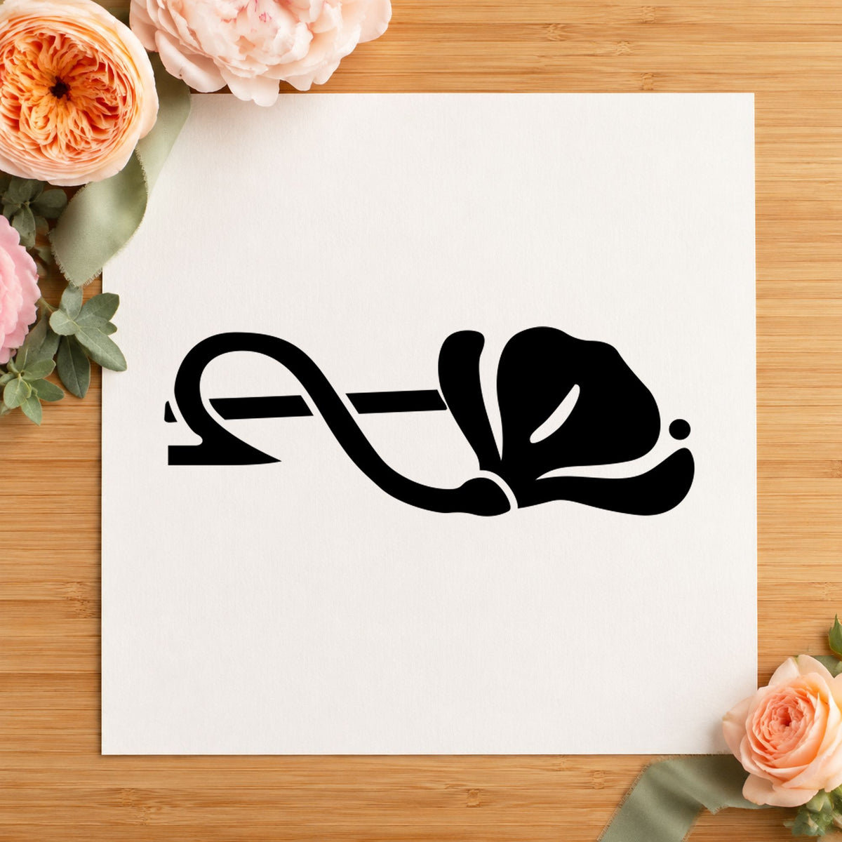Black impression from a floral border stamp, featuring the right single flower border design on white paper.