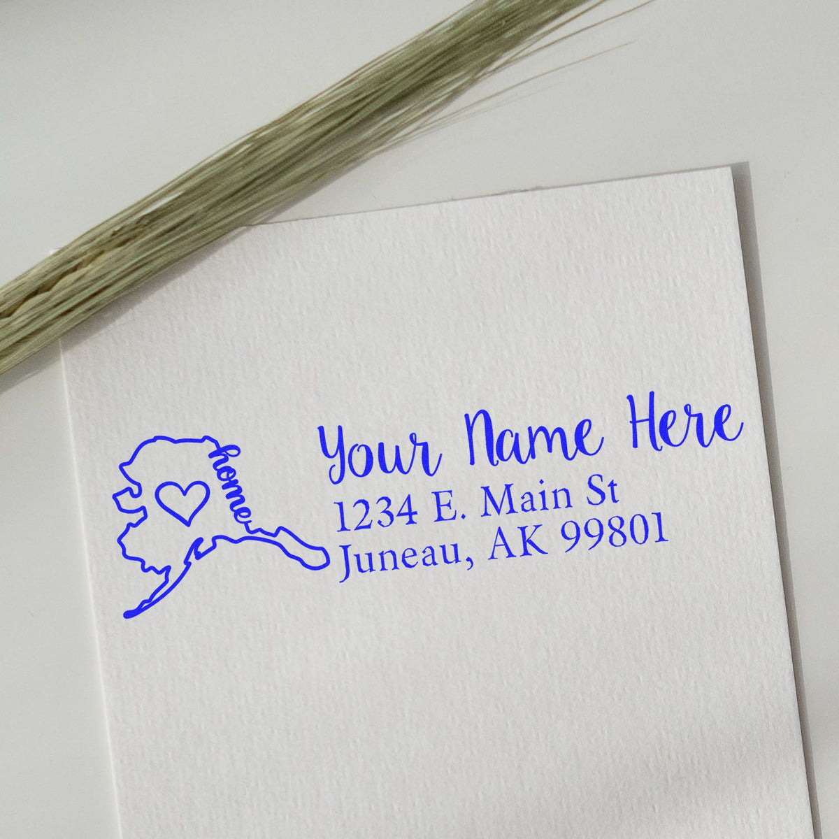 Custom Alaska return address rubber stamp for envelopes, featuring name, street address, and Juneau, AK ZIP code.