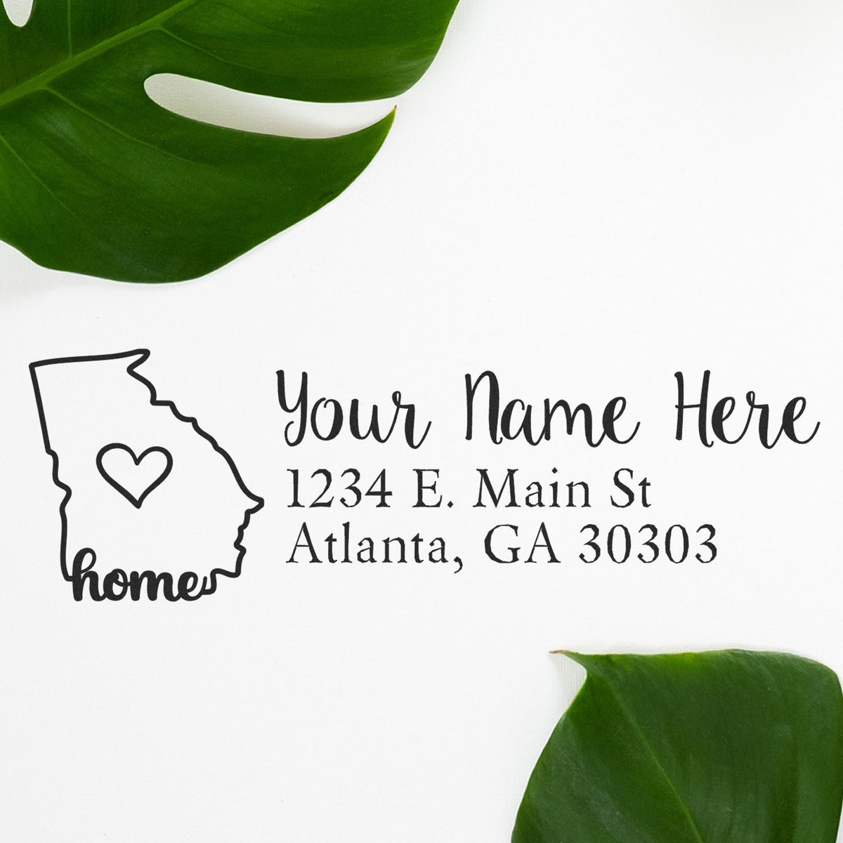 Custom Georgia home address rubber stamp with personalized return address, heart icon, and Atlanta, GA 30303 text.