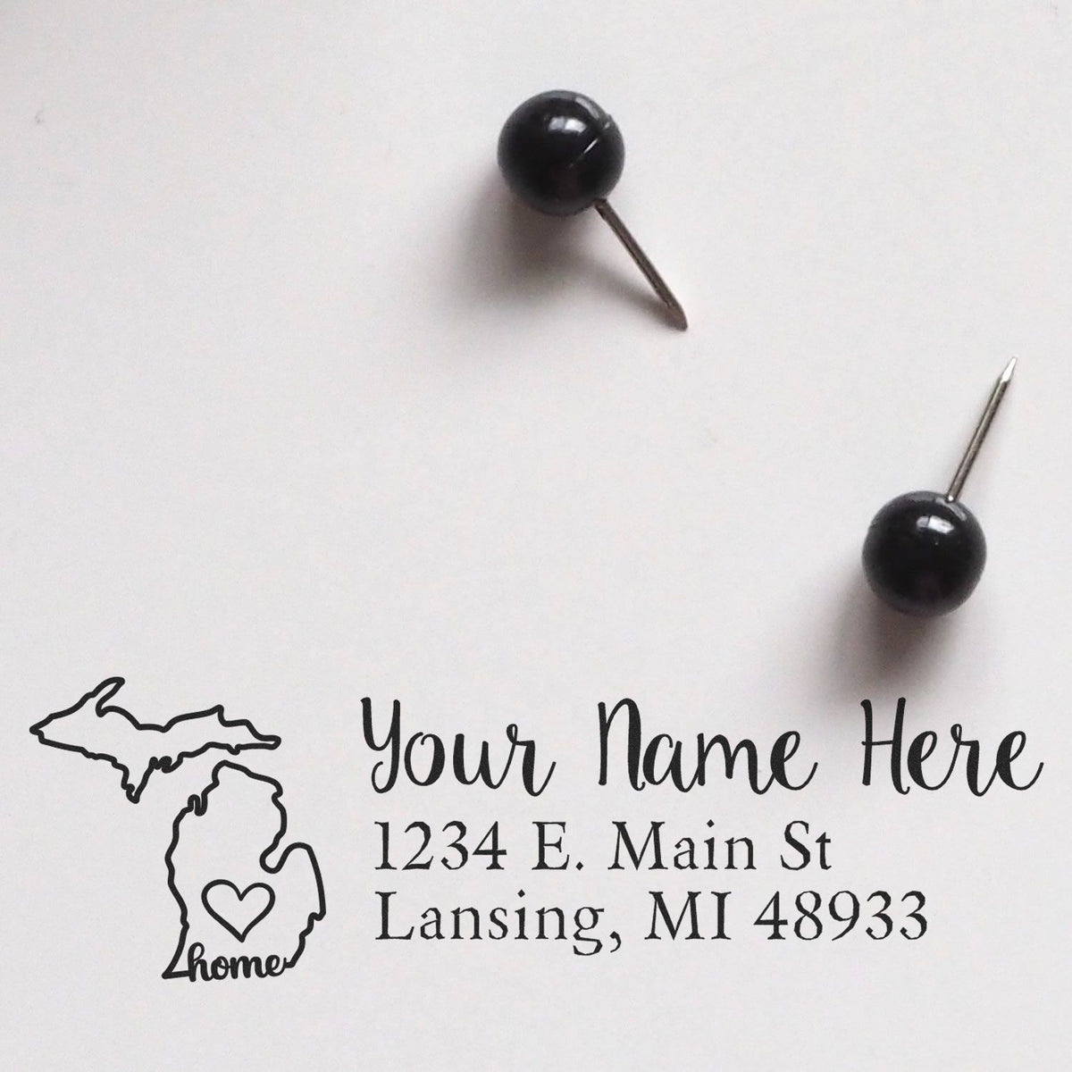 Personalized return address rubber stamp with Michigan home icon and custom name, street, city, state, and ZIP.