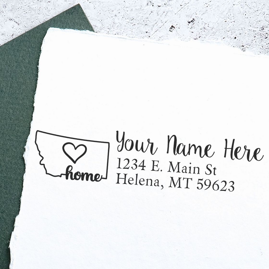 Custom Montana home return address rubber stamp with heart design and personalized name and address.