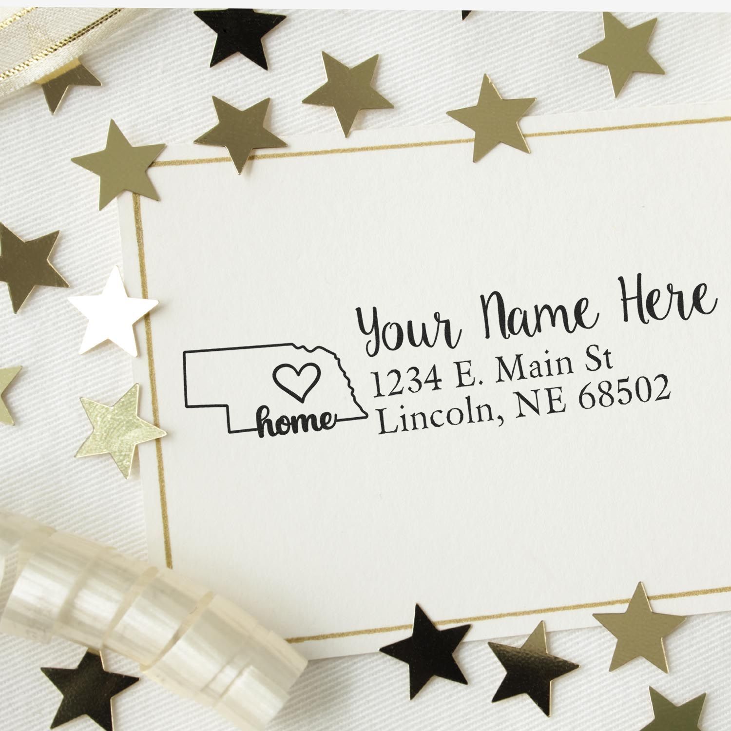 Custom Nebraska return address rubber stamp with home icon and heart, featuring name and mailing address for envelopes.