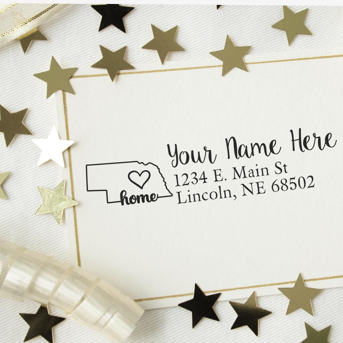 Custom Nebraska return address rubber stamp with personalized name, home icon, and mailing address design.