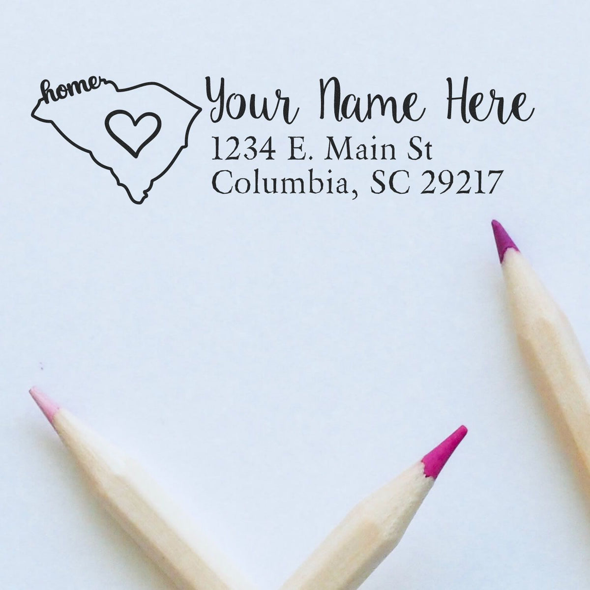 Personalized South Carolina return address rubber stamp with heart, name, and Columbia, SC 29217.