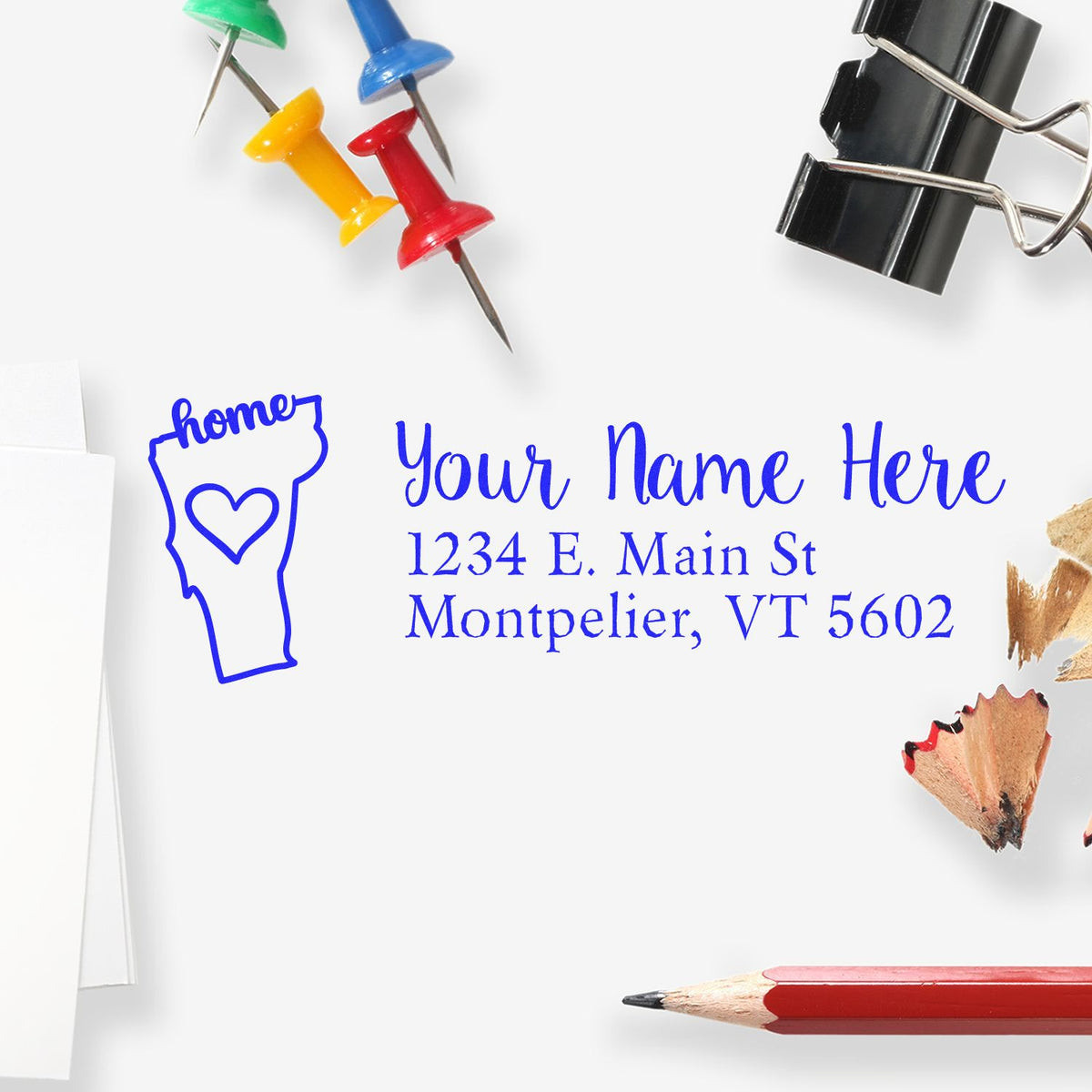 Personalized rubber stamp with Vermont home icon and return address for custom envelope mailing.