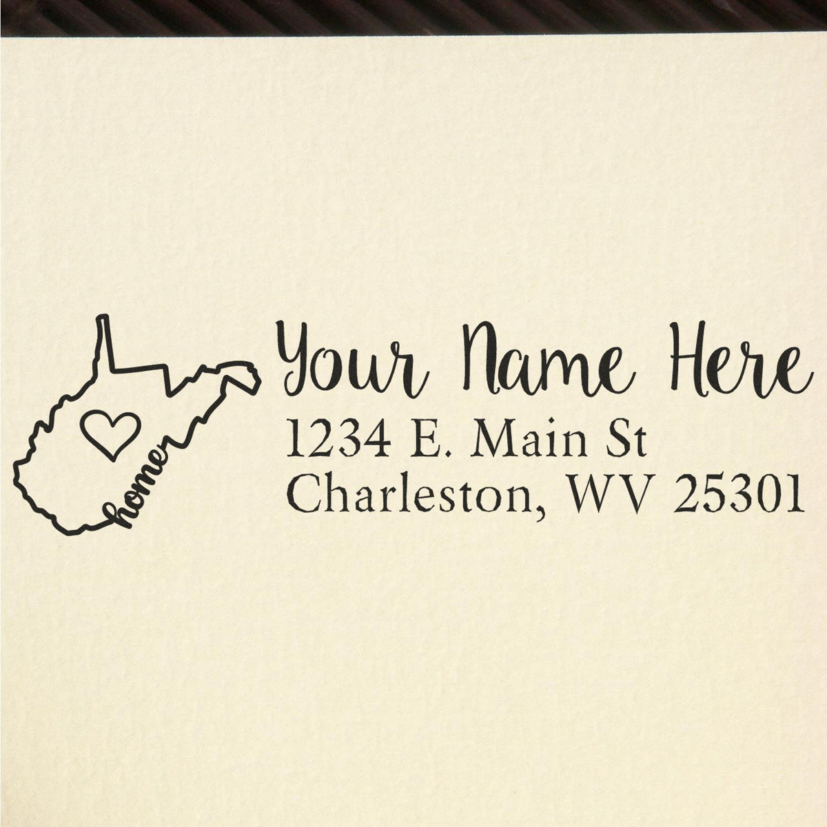 Personalized return address rubber stamp with West Virginia home icon, name line, and Charleston, WV mailing address.