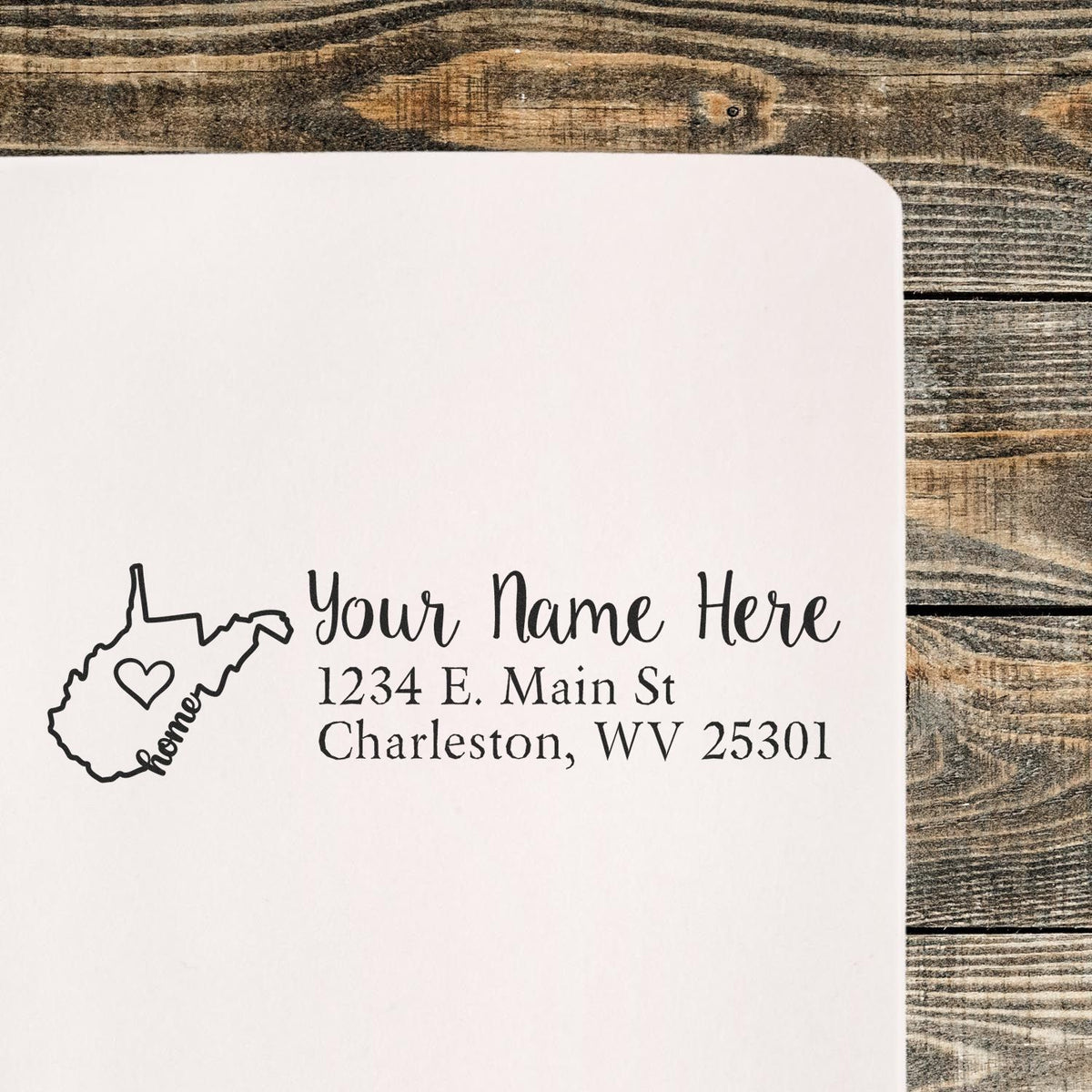 Custom West Virginia return address rubber stamp with heart, name, and address for personalized mailings.
