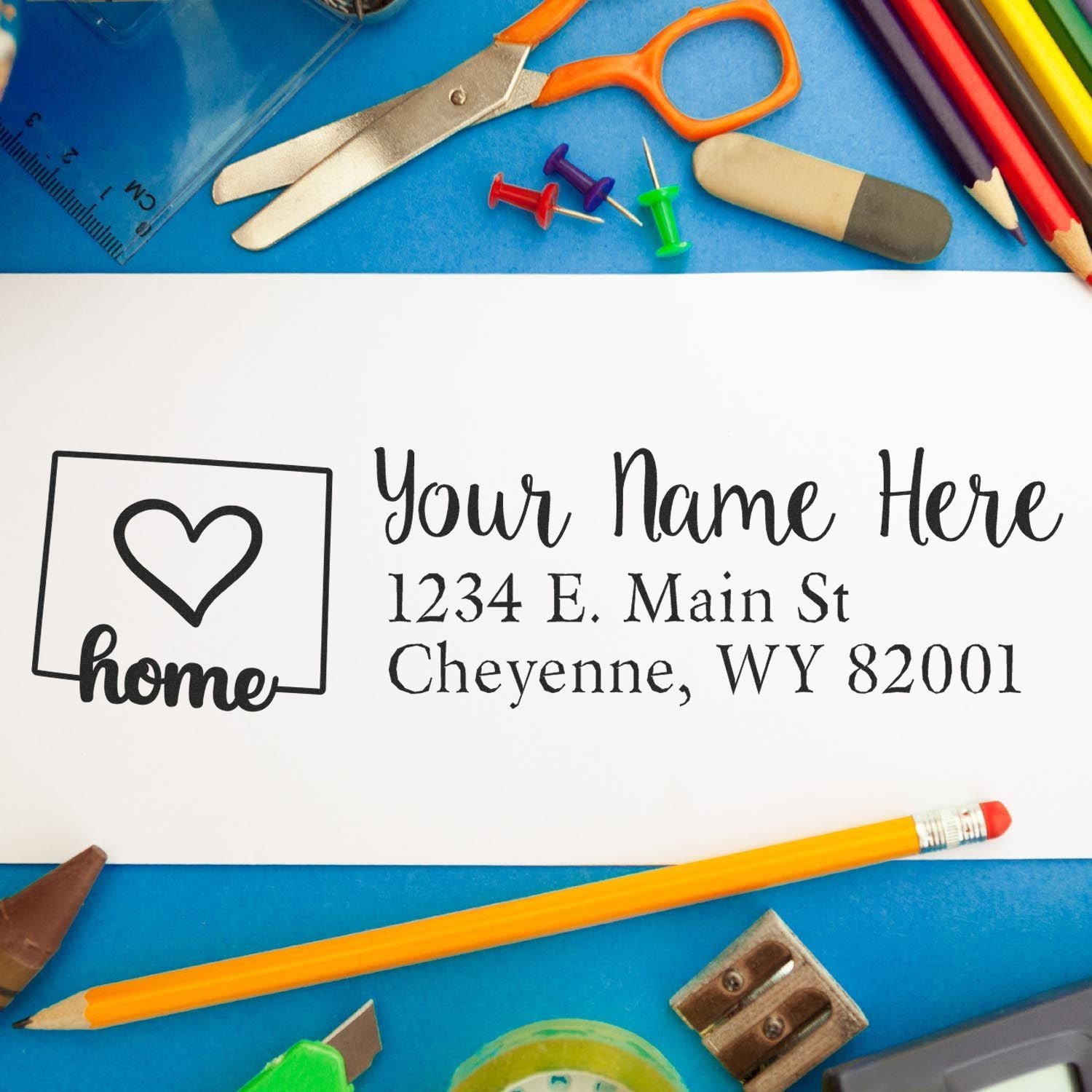 Custom rubber stamp for home address with heart icon and personalized name, ideal for envelopes, stationery, and mailing.