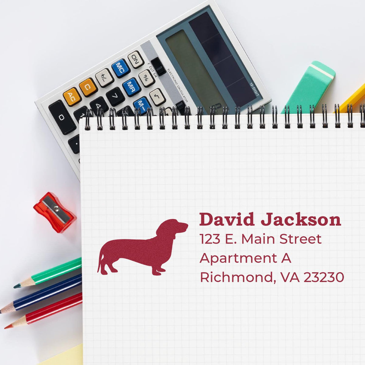 Personalized address rubber stamp with dachshund logo and return address for David Jackson, ideal for mailing and business use.