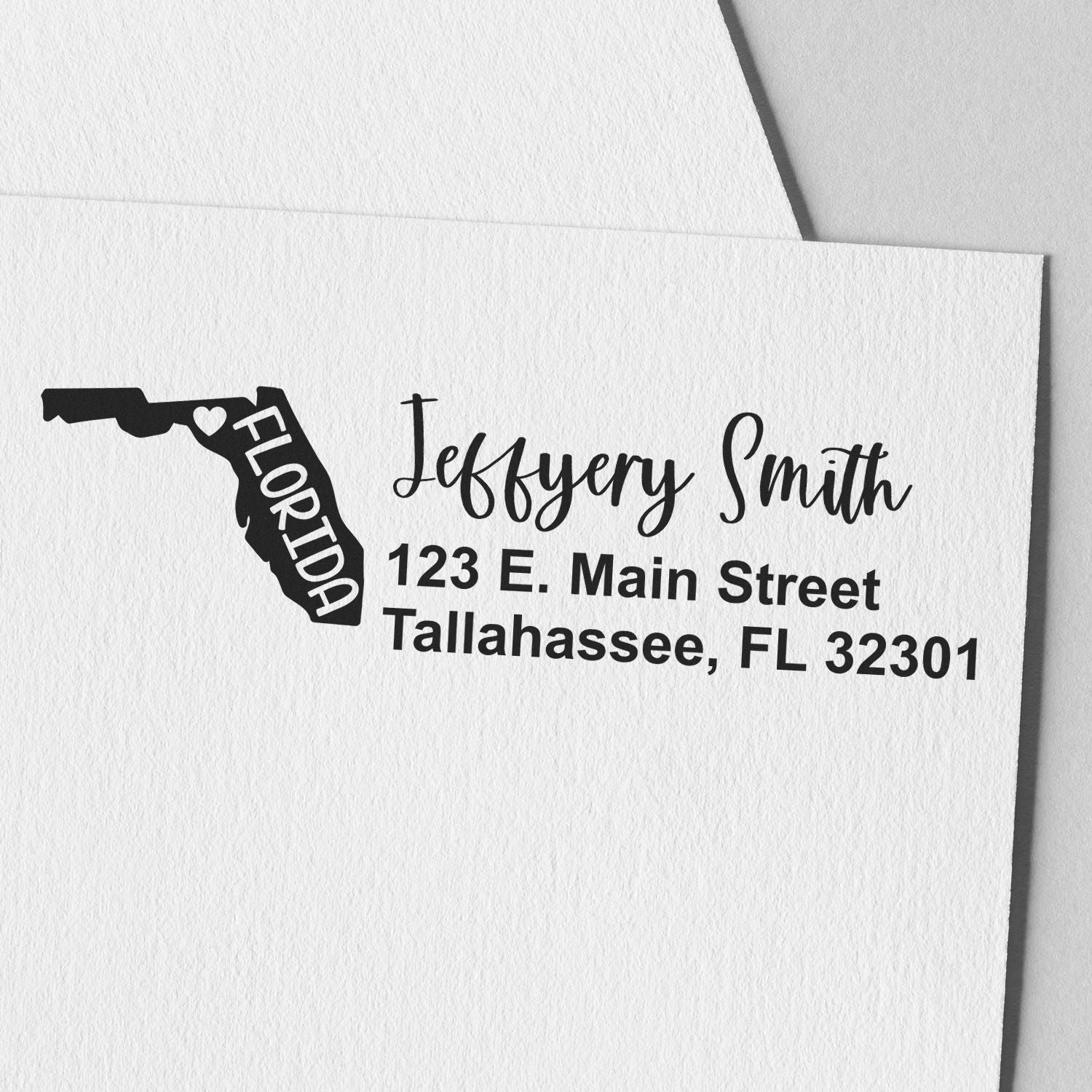 Custom Florida address rubber stamp for envelopes with personalized name and Tallahassee, FL 32301 return address.