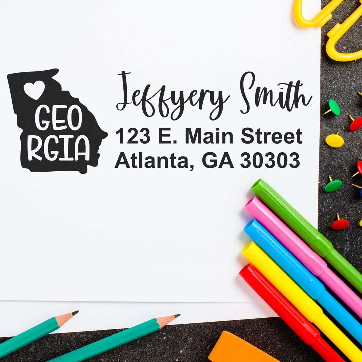 Custom Georgia return address rubber stamp with personalized name and address for school supplies or mailing.