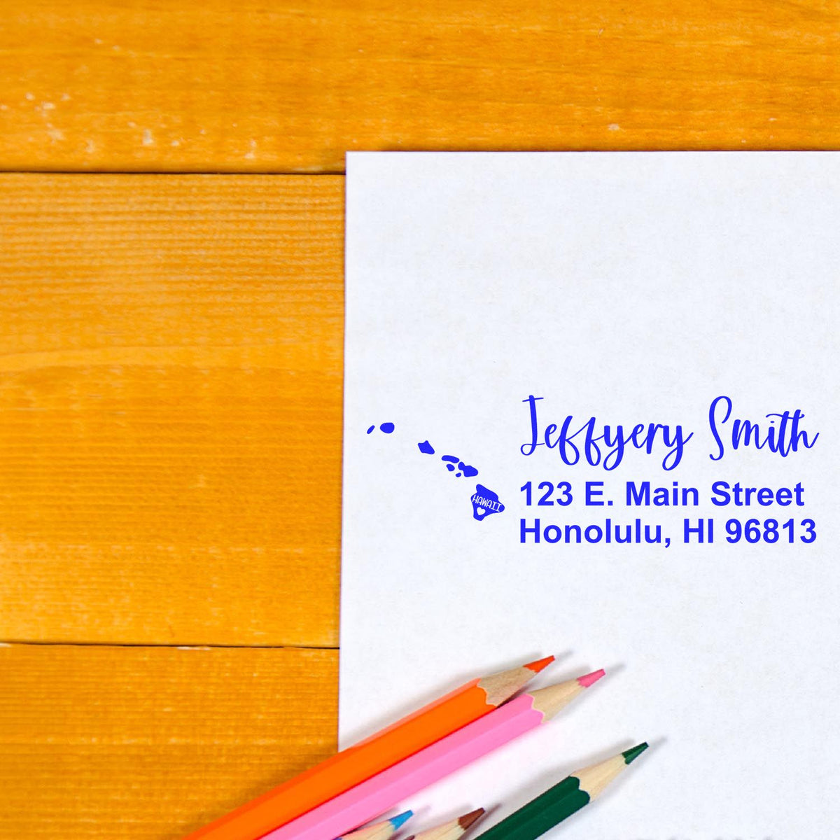 Custom return address rubber stamp on envelope, featuring Hawaii map and personalized mailing address for stationery.