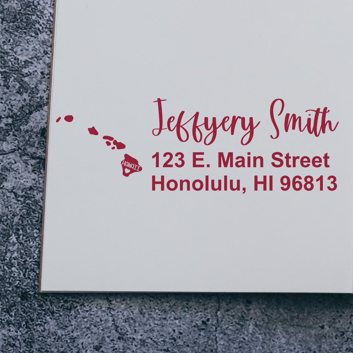Custom rubber return address stamp with name, Honolulu HI address, and Hawaii island design for personalized mailing.