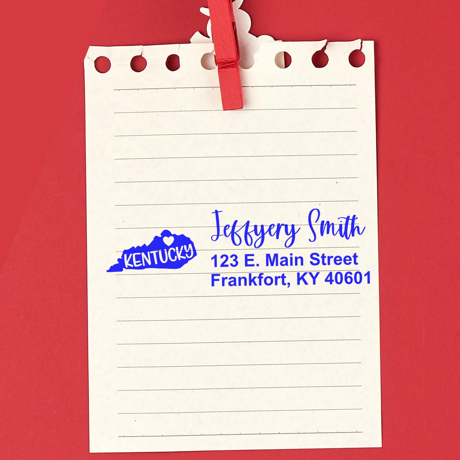 Custom Kentucky return address rubber stamp on notepaper, featuring blue ink name and mailing address.