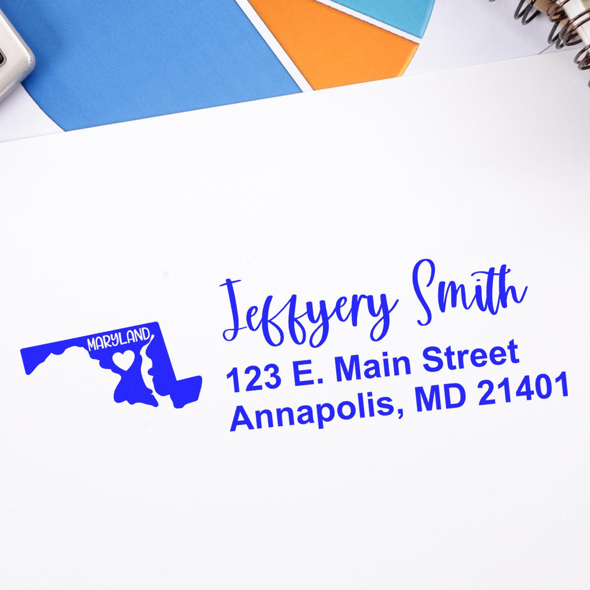 Personalized rubber address stamp with Maryland outline, Jeffery Smith name, and Annapolis, MD address in blue ink.