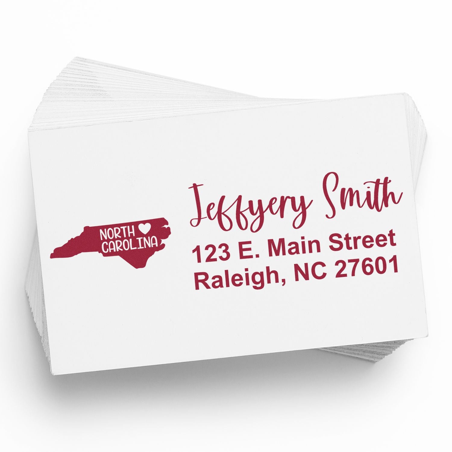 Custom North Carolina address rubber stamp with name and Raleigh, NC return address for personalized mailing.