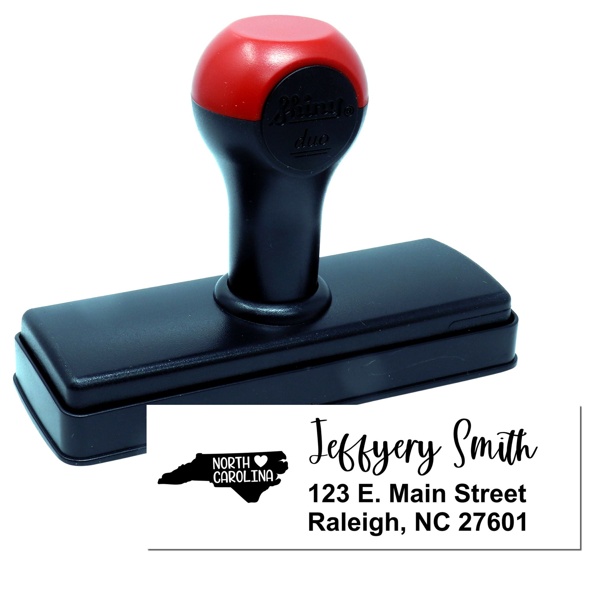 Custom self-inking rubber address stamp with North Carolina design and Jeffrey Smith return address.