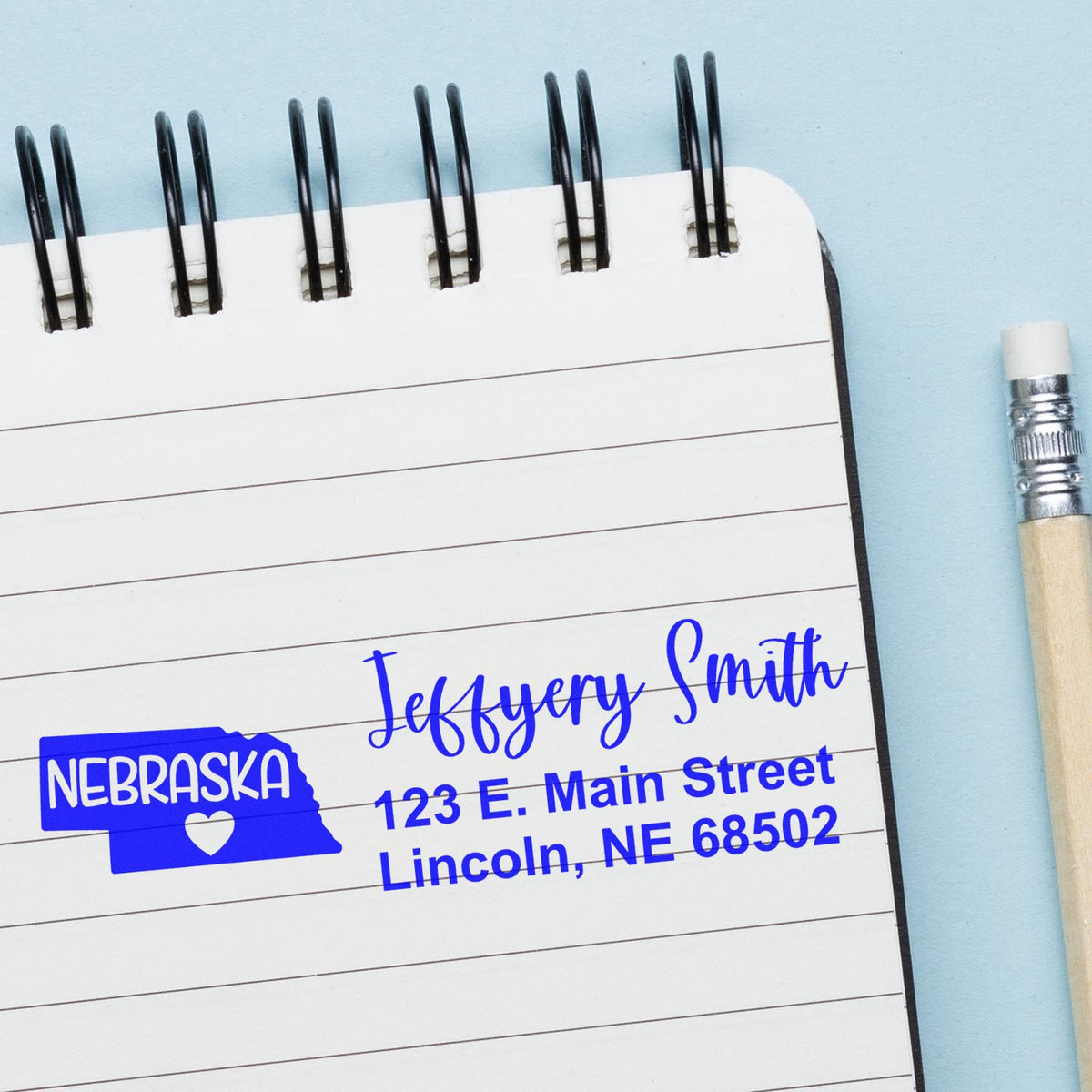 Custom Nebraska return address rubber stamp with name and Lincoln, NE details for personalized mailing and branding.